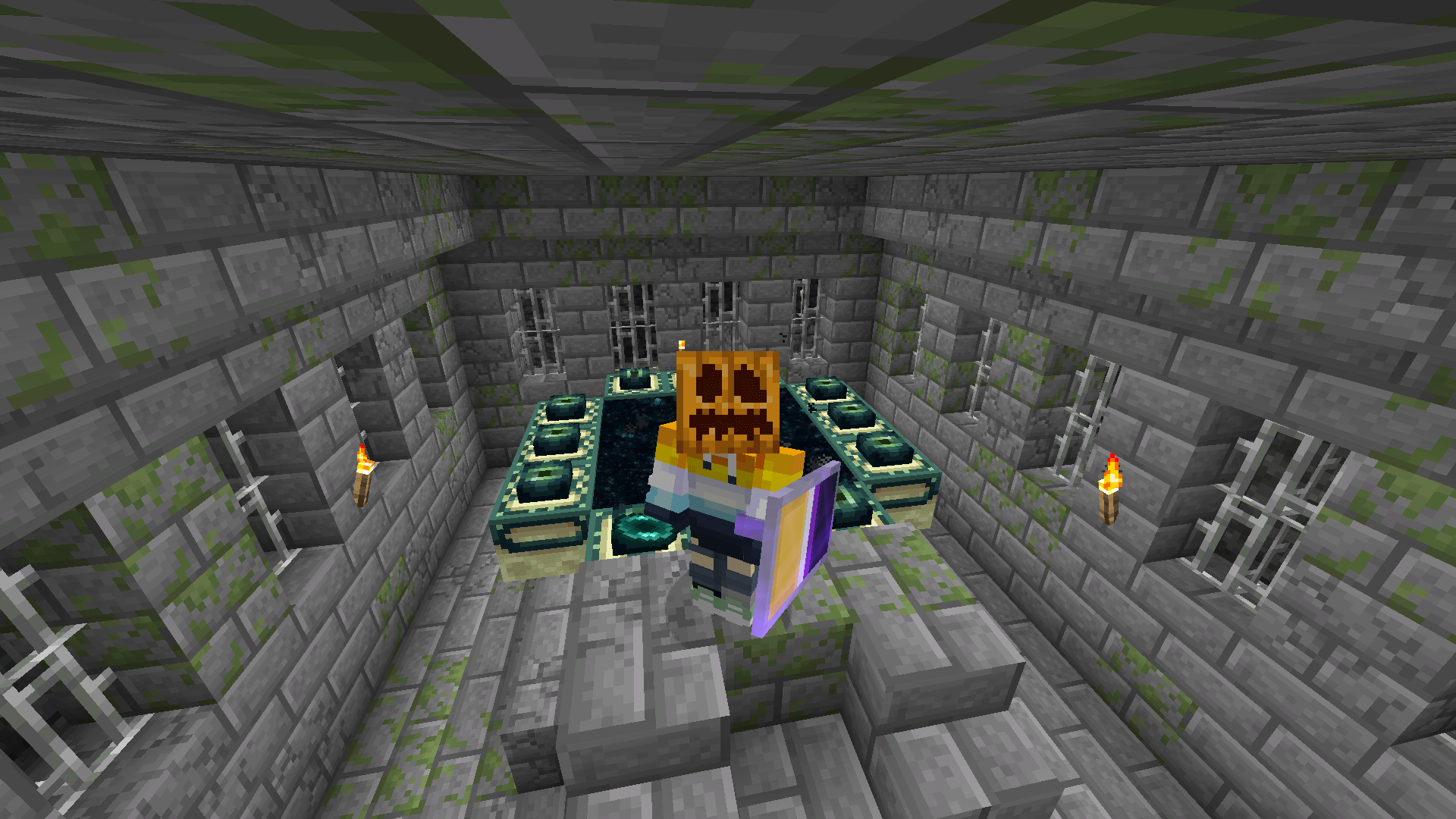 A Minecraft player stands in front of a lit End portal, wearing a carved pumpkin.