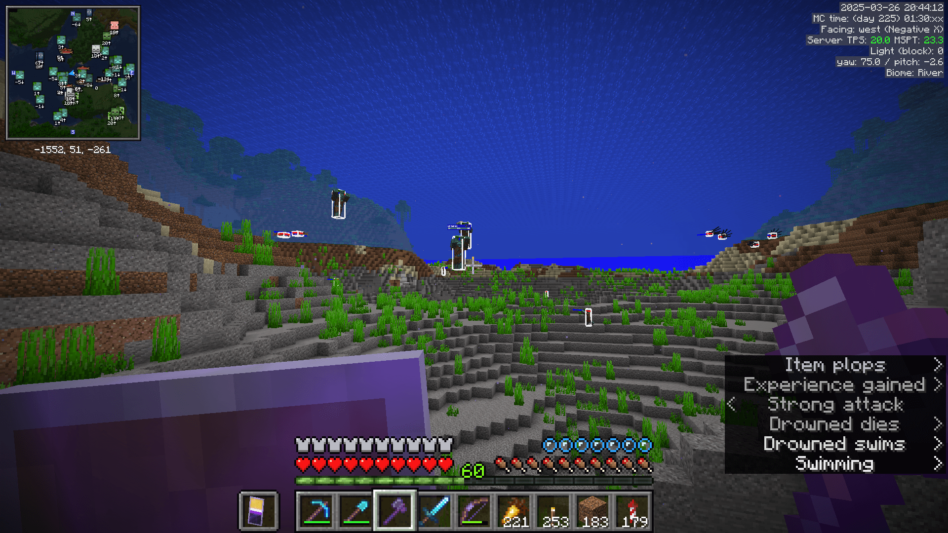 Sometimes the game builds the mob farm for you! A river biome with several drowned in view. The minimap shows many more drowned near the player's location.