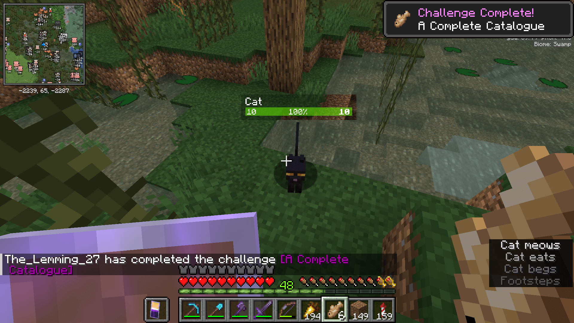Maybe he just wants me for the cookie in my pocket? Taming a black cat to complete the "A Complete Catalogue" advancement.