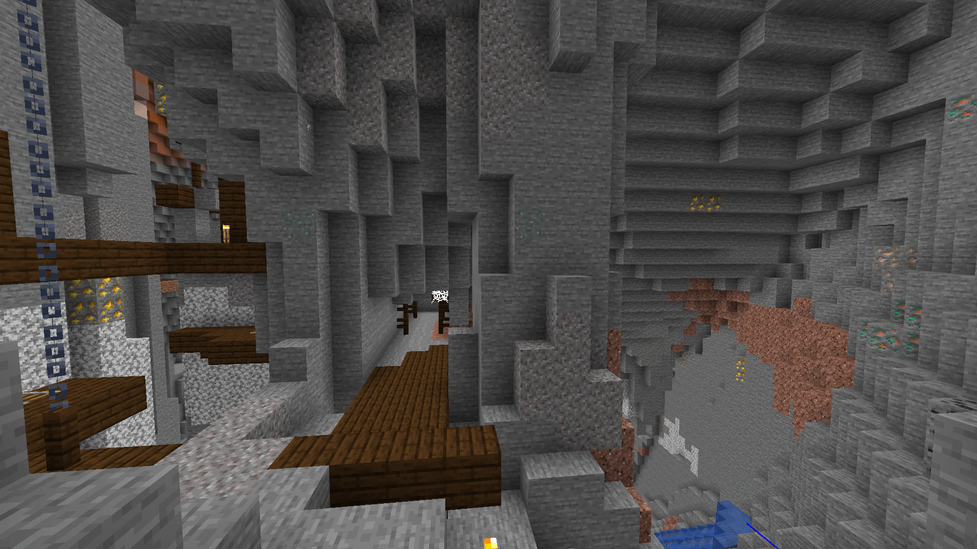 This place is O for Oresome. That's another lil' bit of kiwi slang :D An underground section of a badlands mineshaft, featuring dark oak platforms and gold ore in the walls.