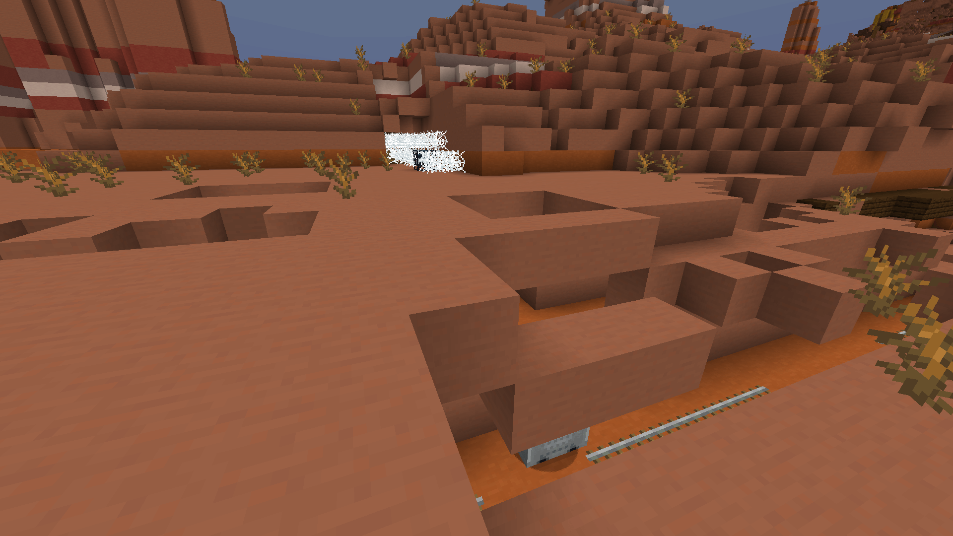 Can't believe they put Australia in Minecraft. A surface section of a badlands mineshaft, with a cave spider spawner surrounded by cobwebs.