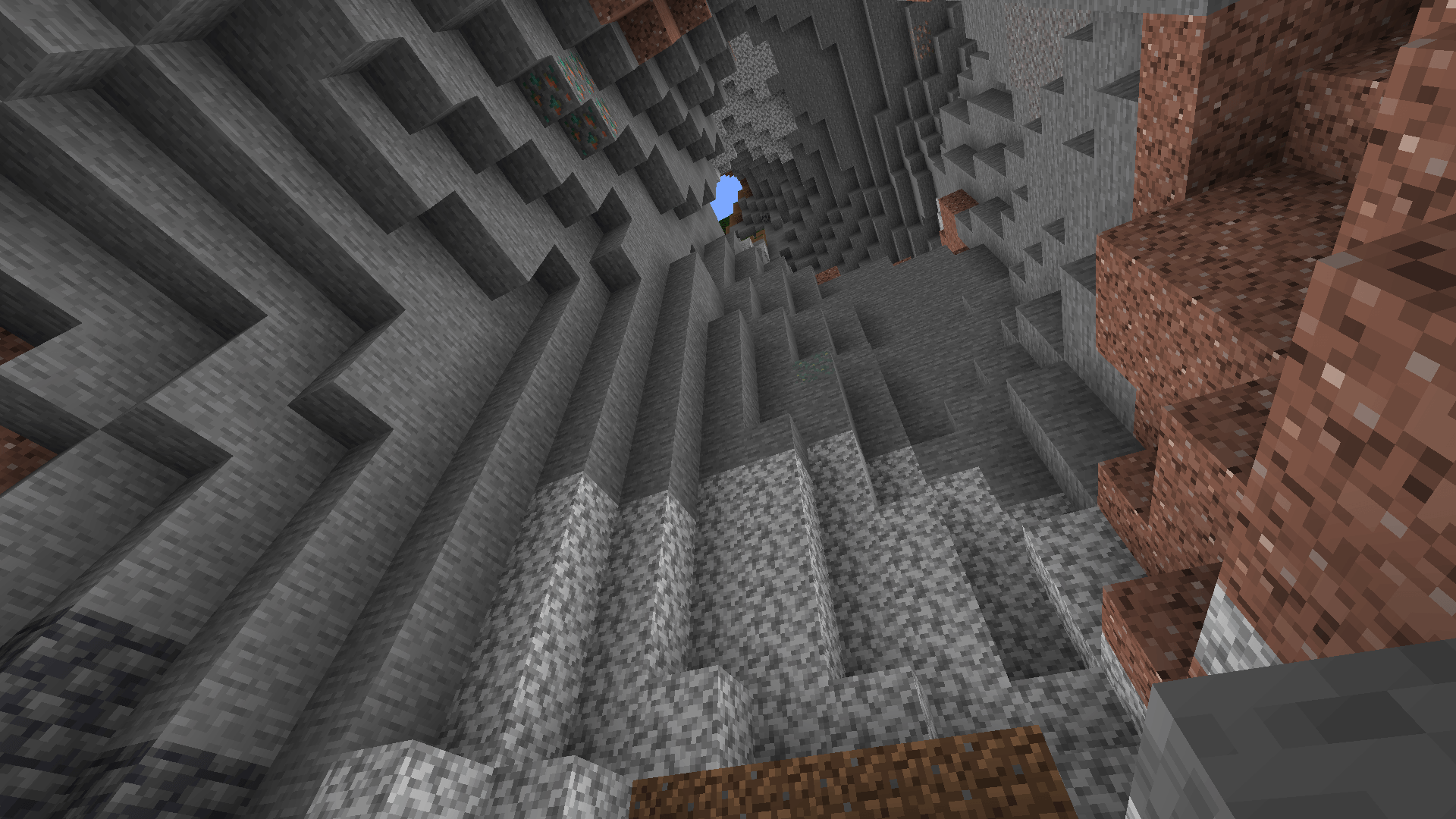 Sweet daylight! I was starting to lose hope... Looking up from the stone-to-deepslate level of a cave to an opening at the surface.