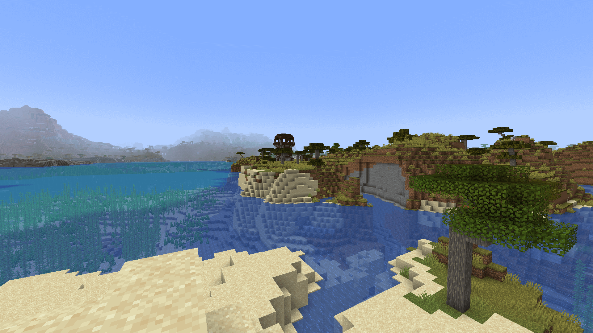 They sure picked a scenic spot. A pillager outpost, with beach in the foreground and mountains in the distance.