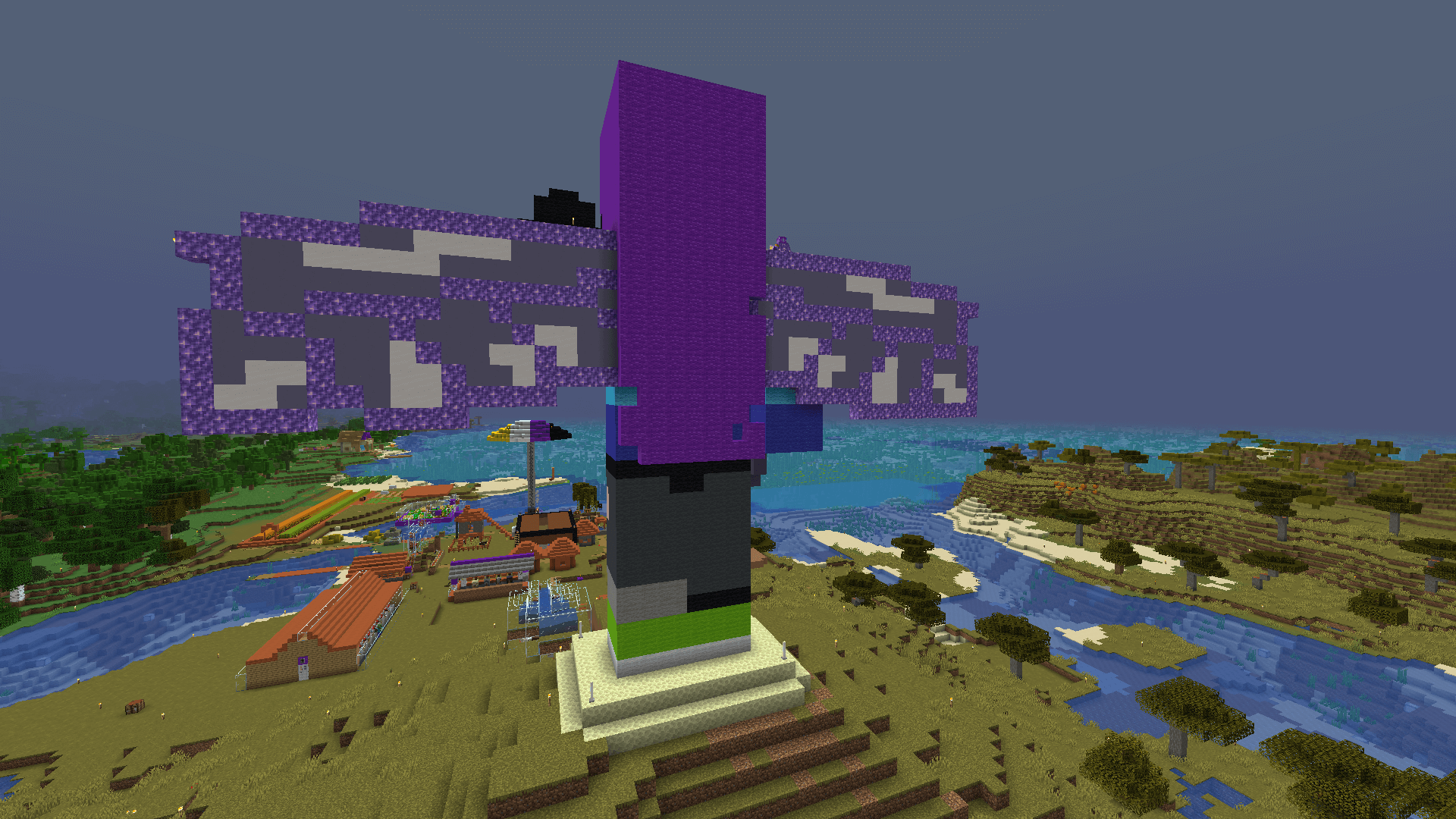 The village looks so tiny from up here! Back view of the statue, showing the outstretched amethyst wings, and a view of the village below.