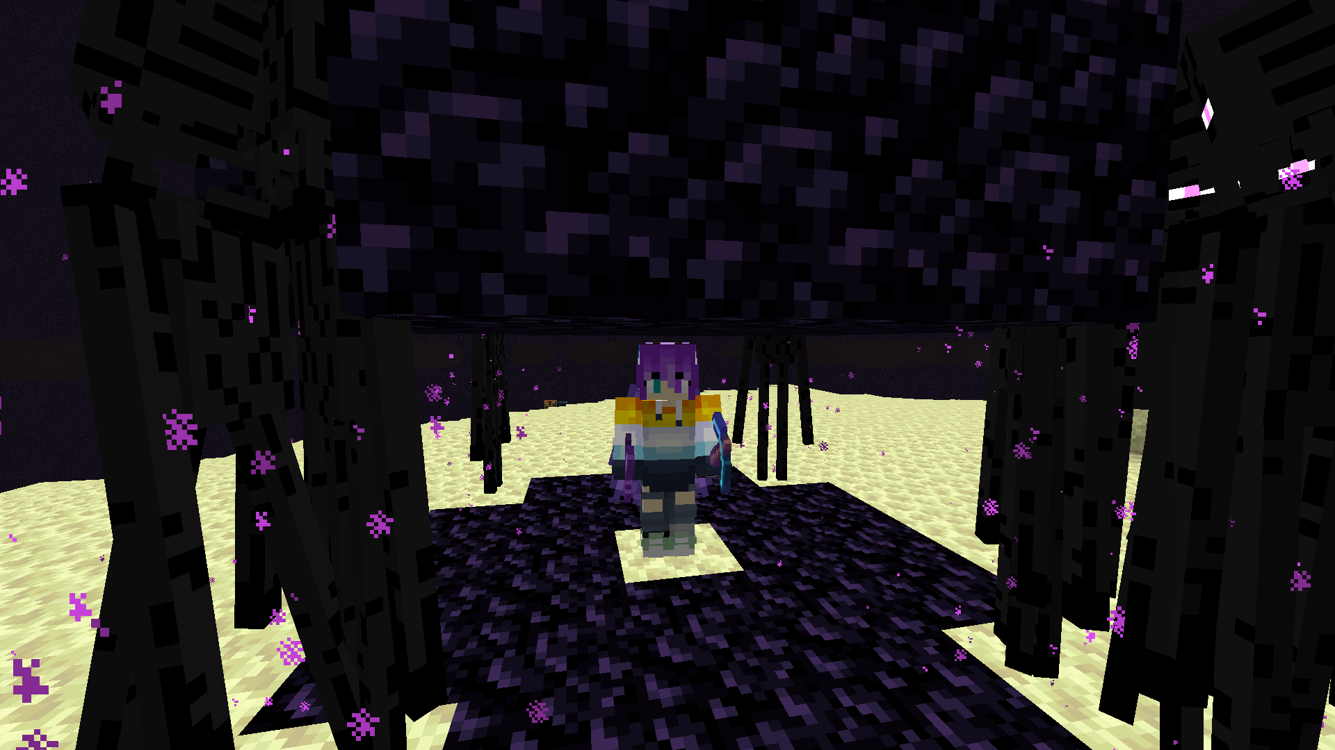 The endermen know of my greatness too! That's why they've gathered around me, right? A Minecraft player stands in a hollowed out obsidian pillar on the End island, surrounded by endermen.