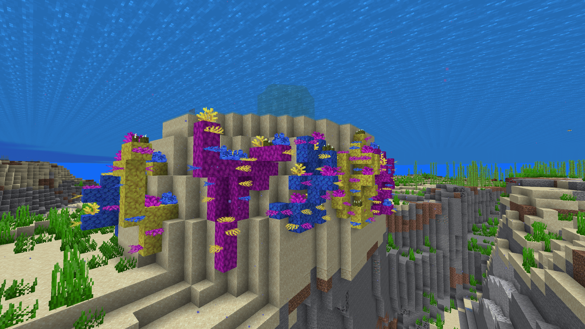 This project really took ATOLL on me! A wall of sand, adorned with coloured coral blocks, overhanging an ocean trench.