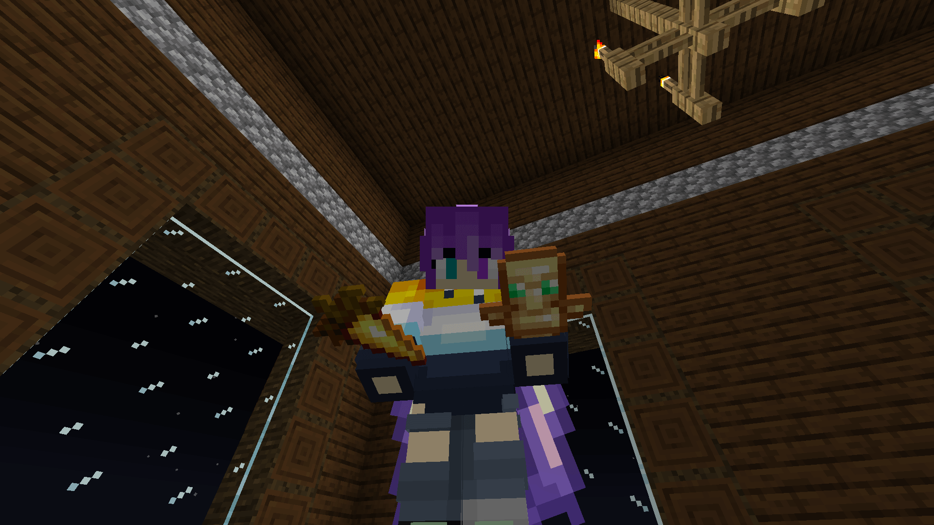 Ela stands by the mansion windows, holding up a totem of undying.