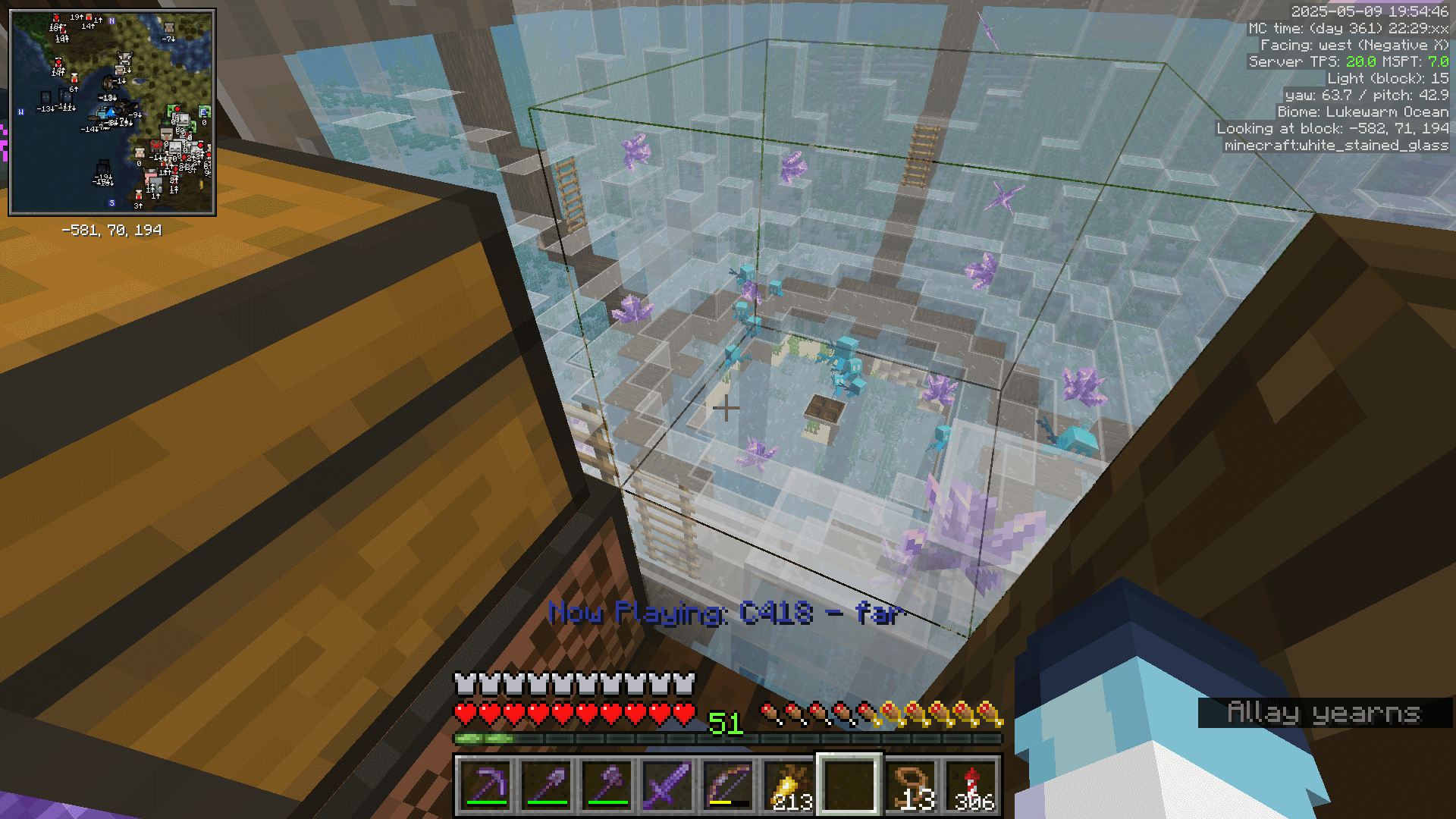 Several allays float around in a glass enclosure. The C418 far music disc is playing, as indicated by subtitles in the lower centre of screen.