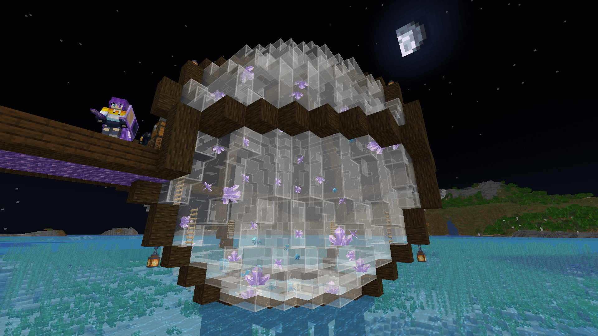 A glass sphere in the ocean, wrapped in dark oak, filled with allays. Ela stands on the amethyst walkway to the left, while the moon hangs in the sky at the upper right.