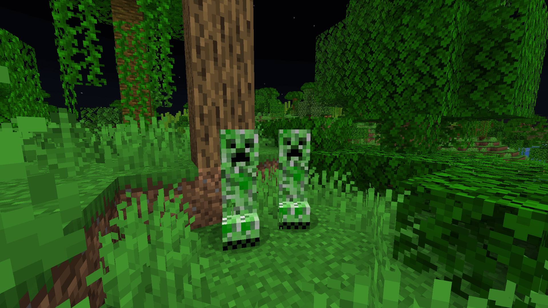Two creepers standing in front of an oak tree in a jungle biome.