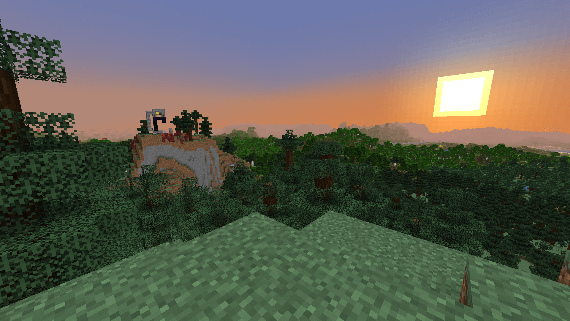 Looking out from a hill in a spruce biome, towards another hill that has a ruined portal on top, while the sun sets to the right of screen.