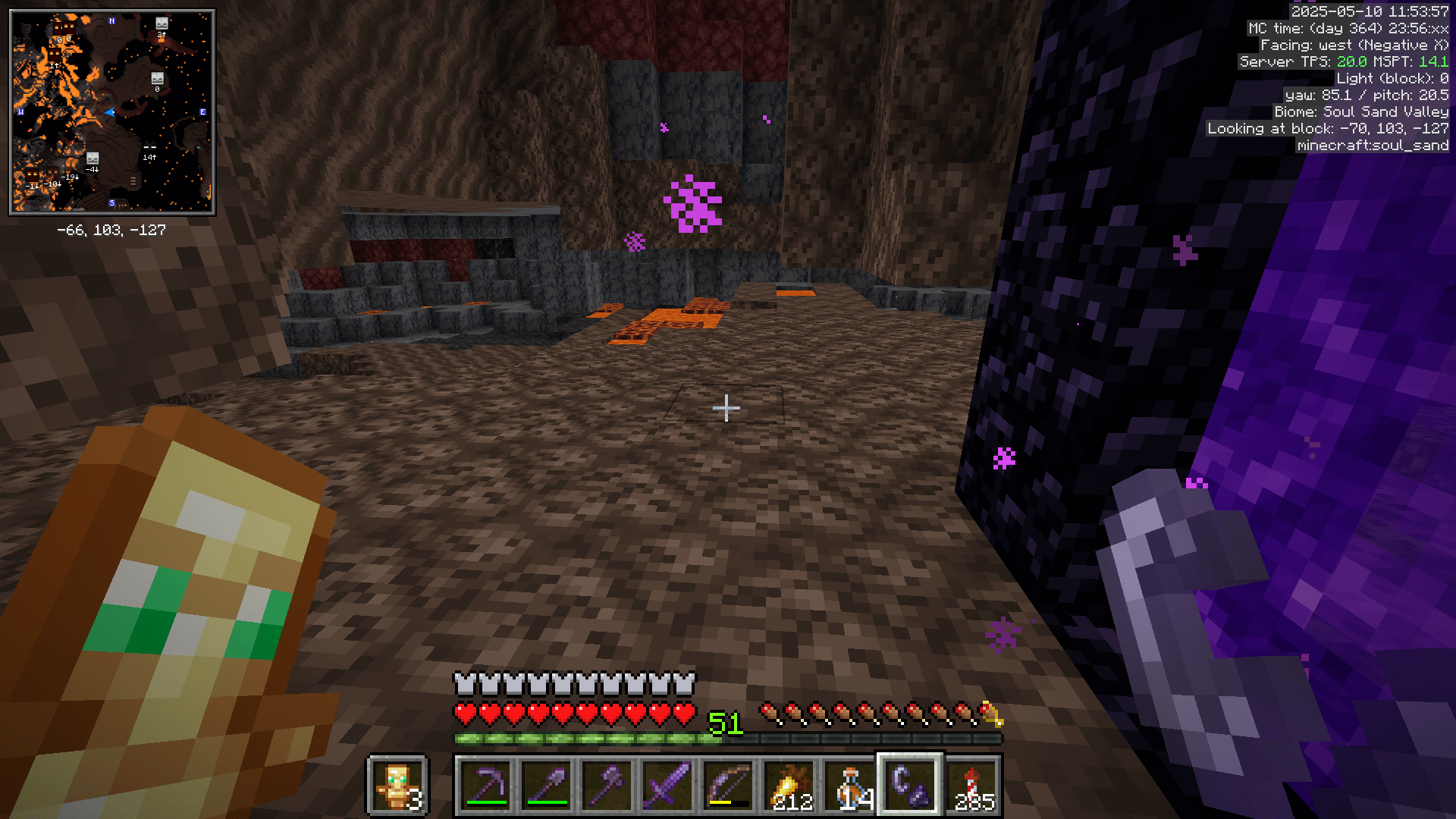 Standing next to a nether portal in an enclosed room of soul sand valley biome.
