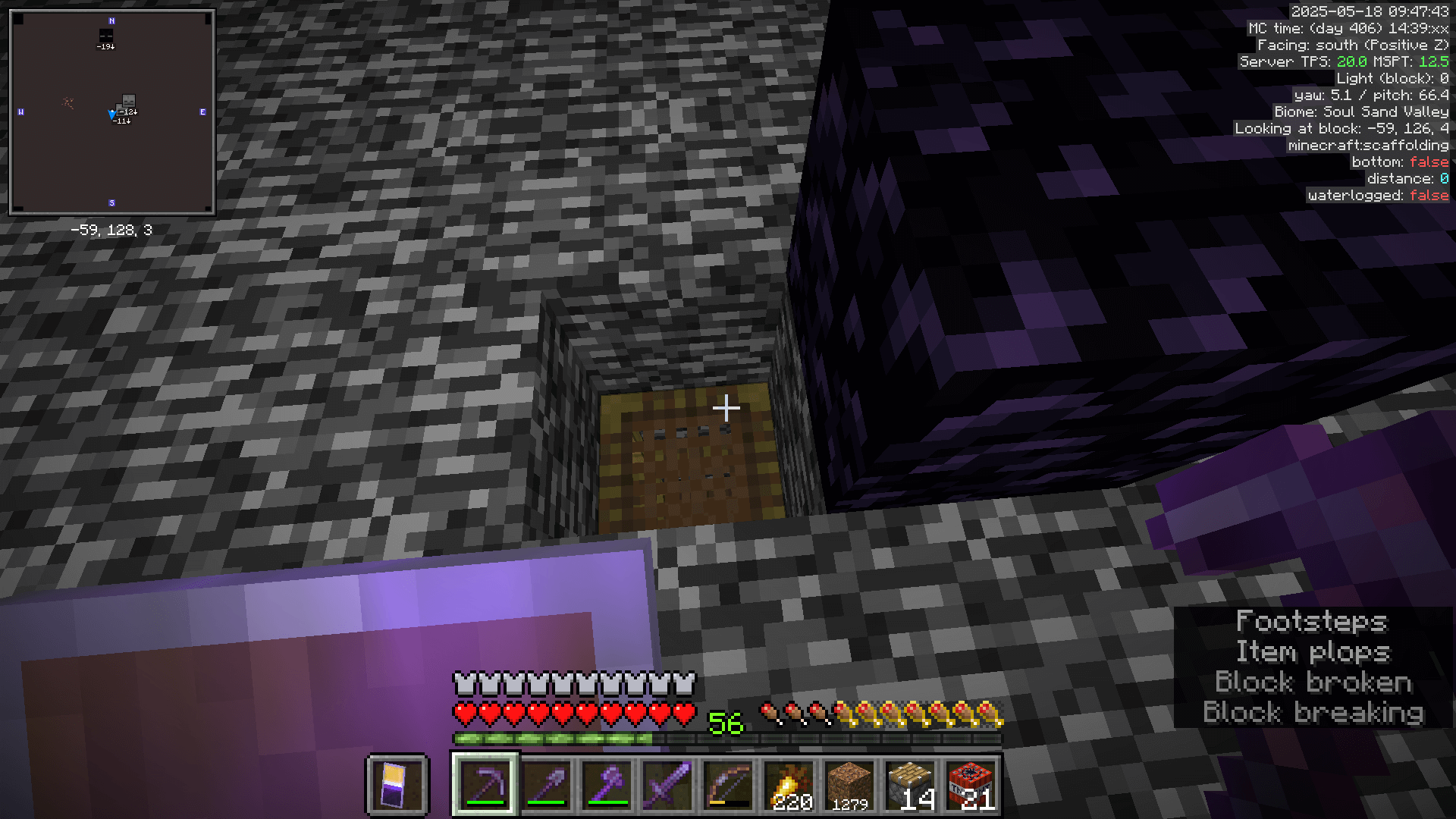 Looking down at a piece of scaffolding through a gap in the bedrock of the nether roof.