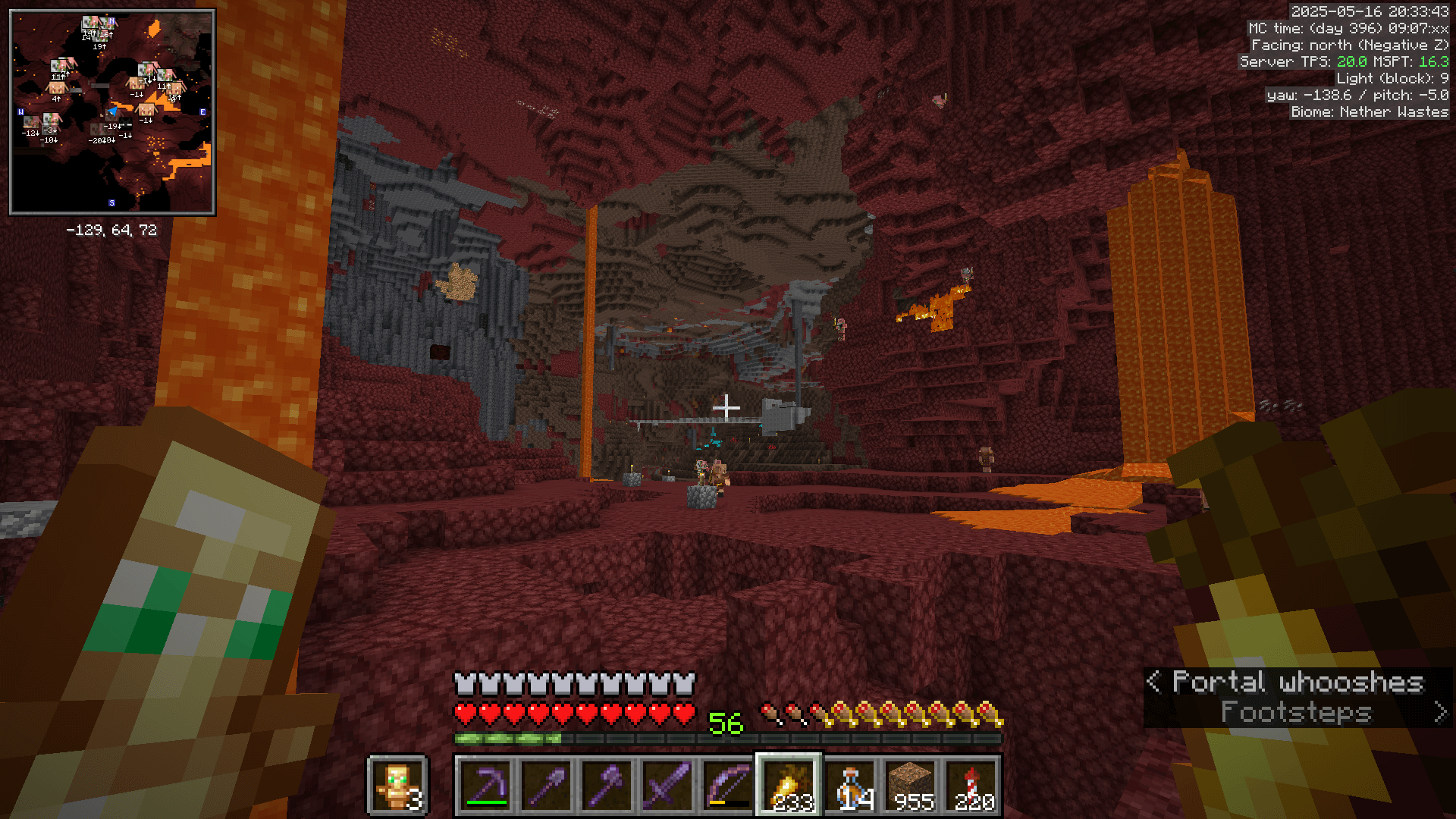 A view over the nether wastes towards a soul sand valley area, where there is a rough cobblestone construction in the distance. There are two lava falls in the foreground and another in the middle distance.