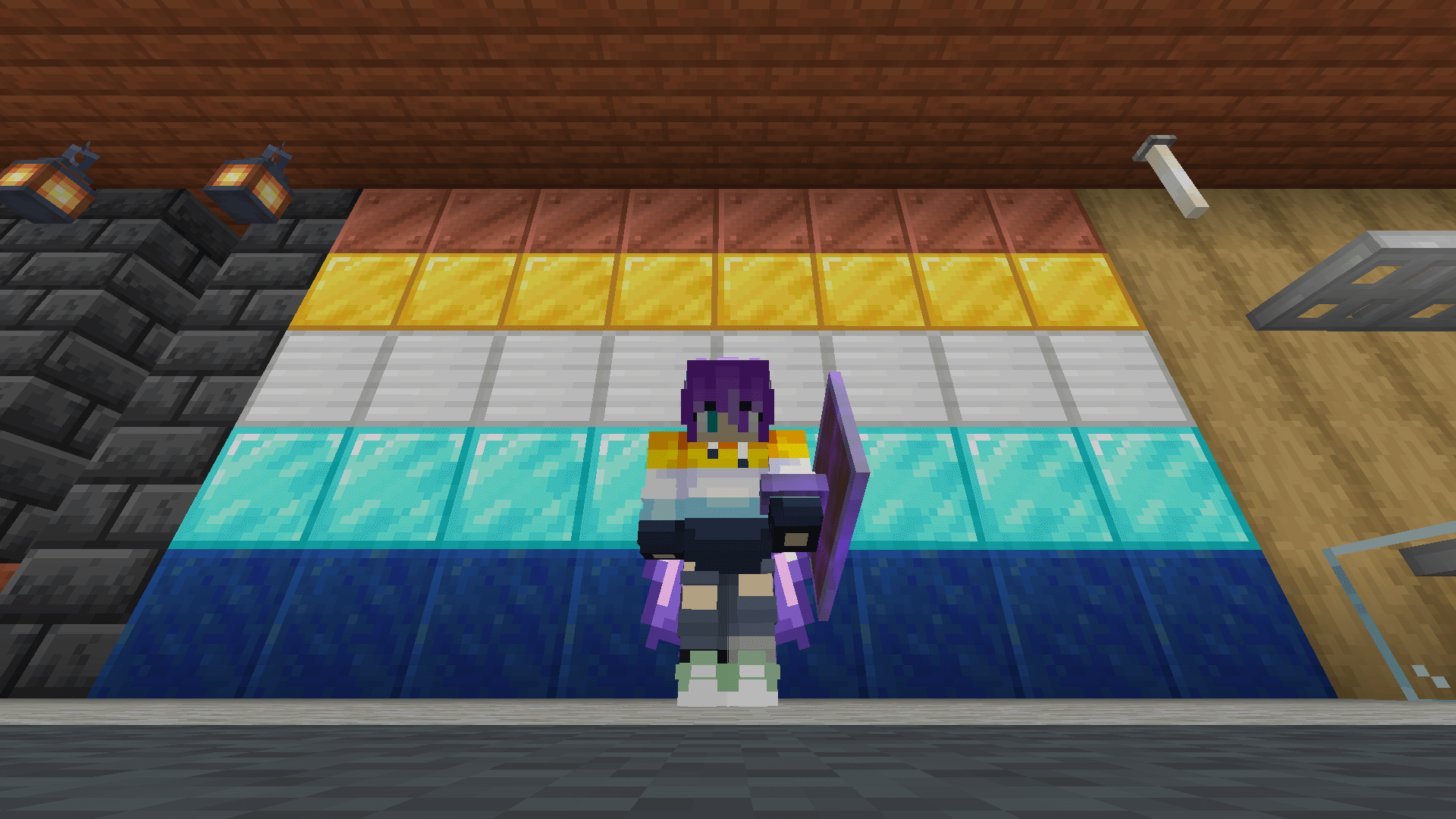 A recreation of the aroace pride flag using mineral blocks: copper, gold, iron, diamond, and lapis lazuli.