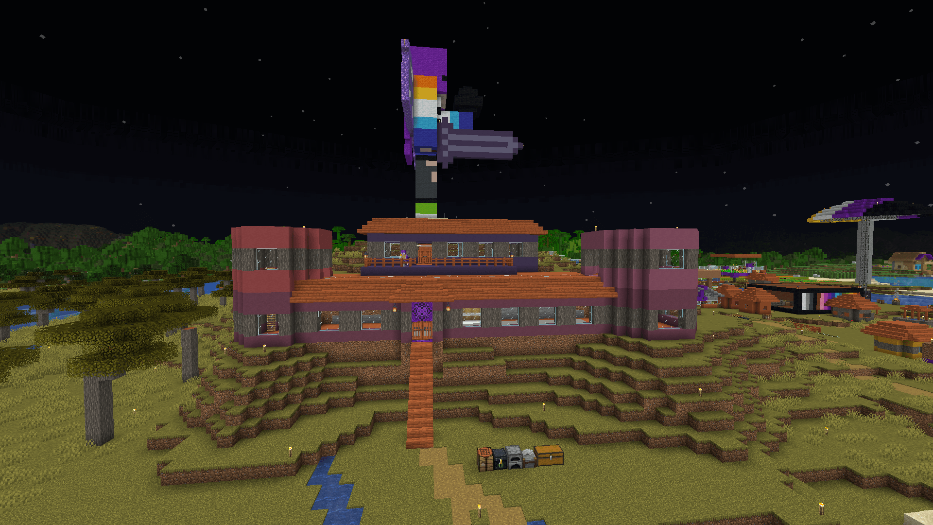 The same house, with cylindrical coloured terracotta structures added to the ends.