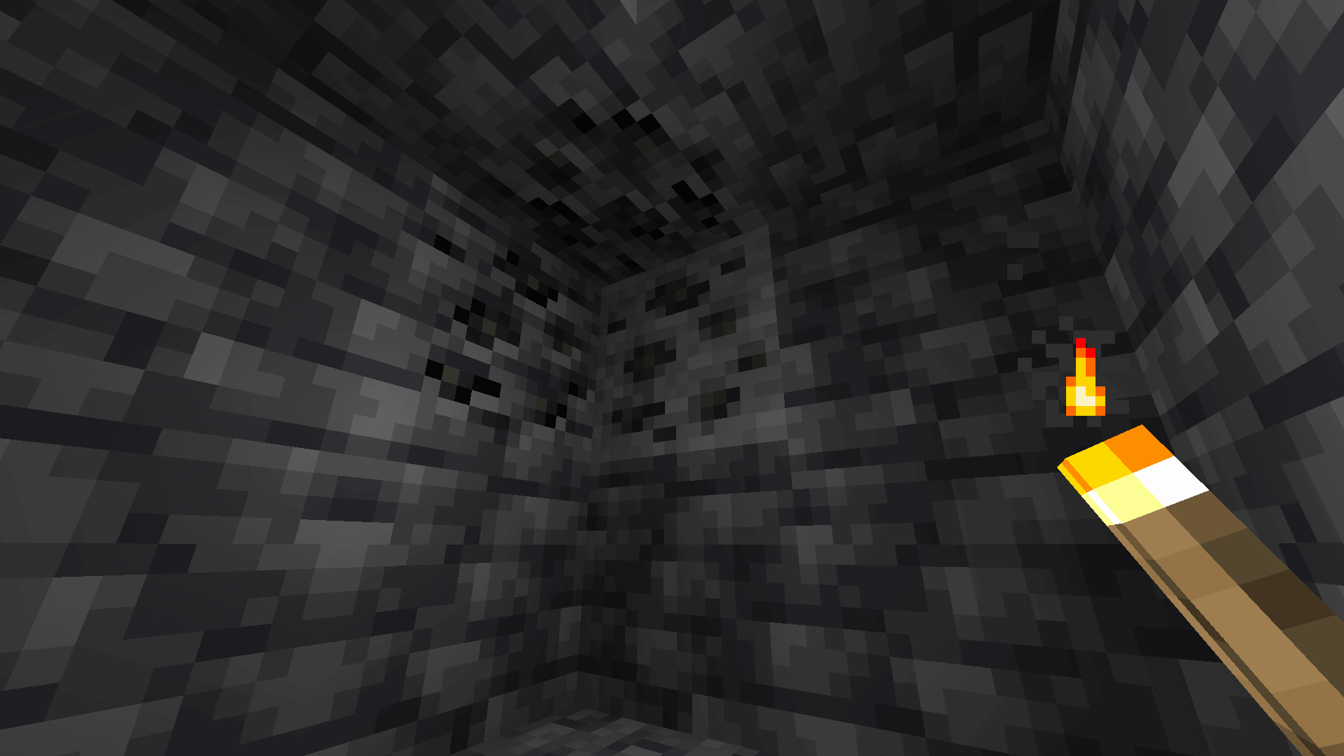 Mining out a cluster of deepslate coal ore.