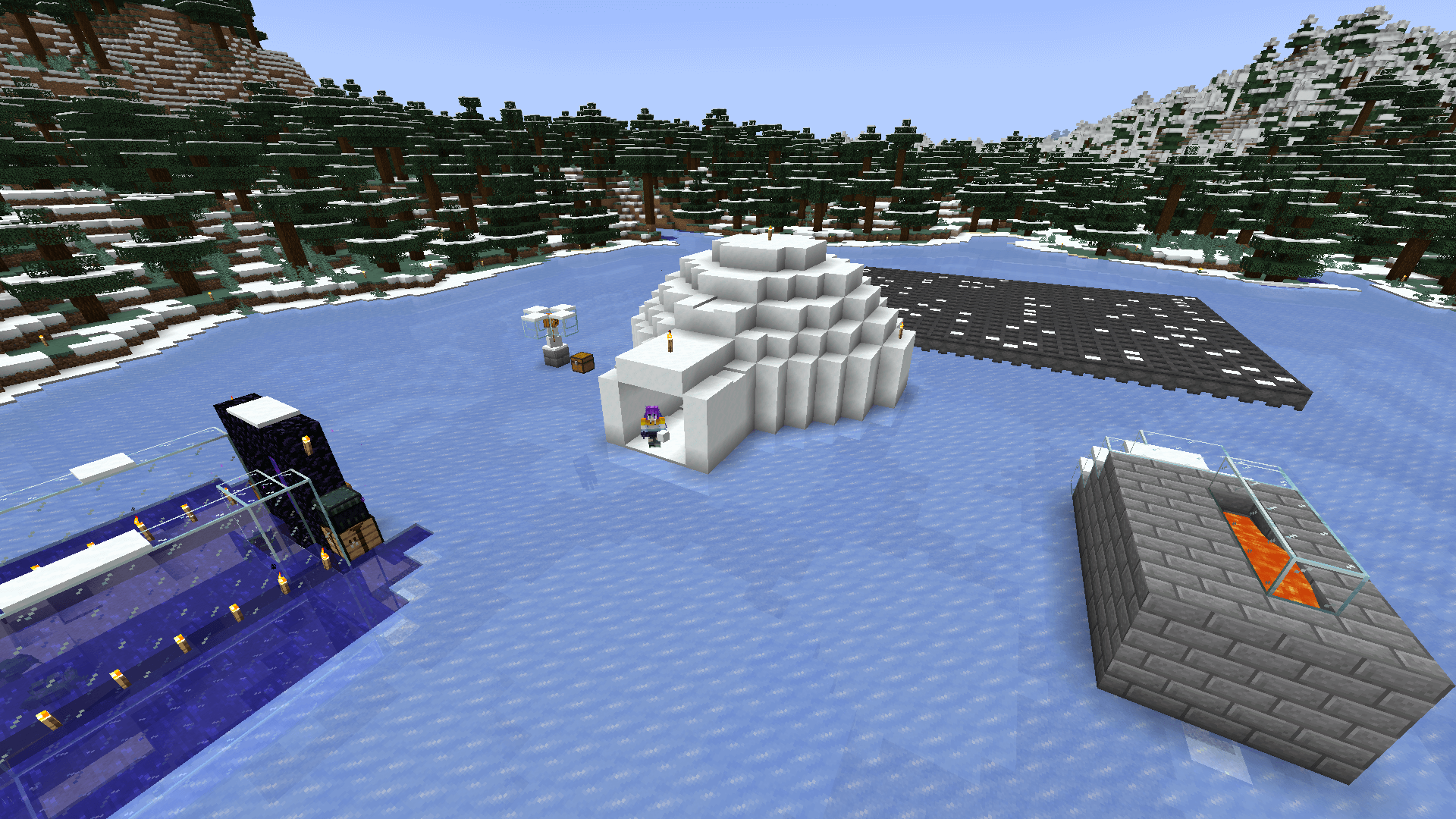 Ela stands in the entrance of an igloo built on a frozen lake. Some green frogs in an enclosure are visible in the foreground.