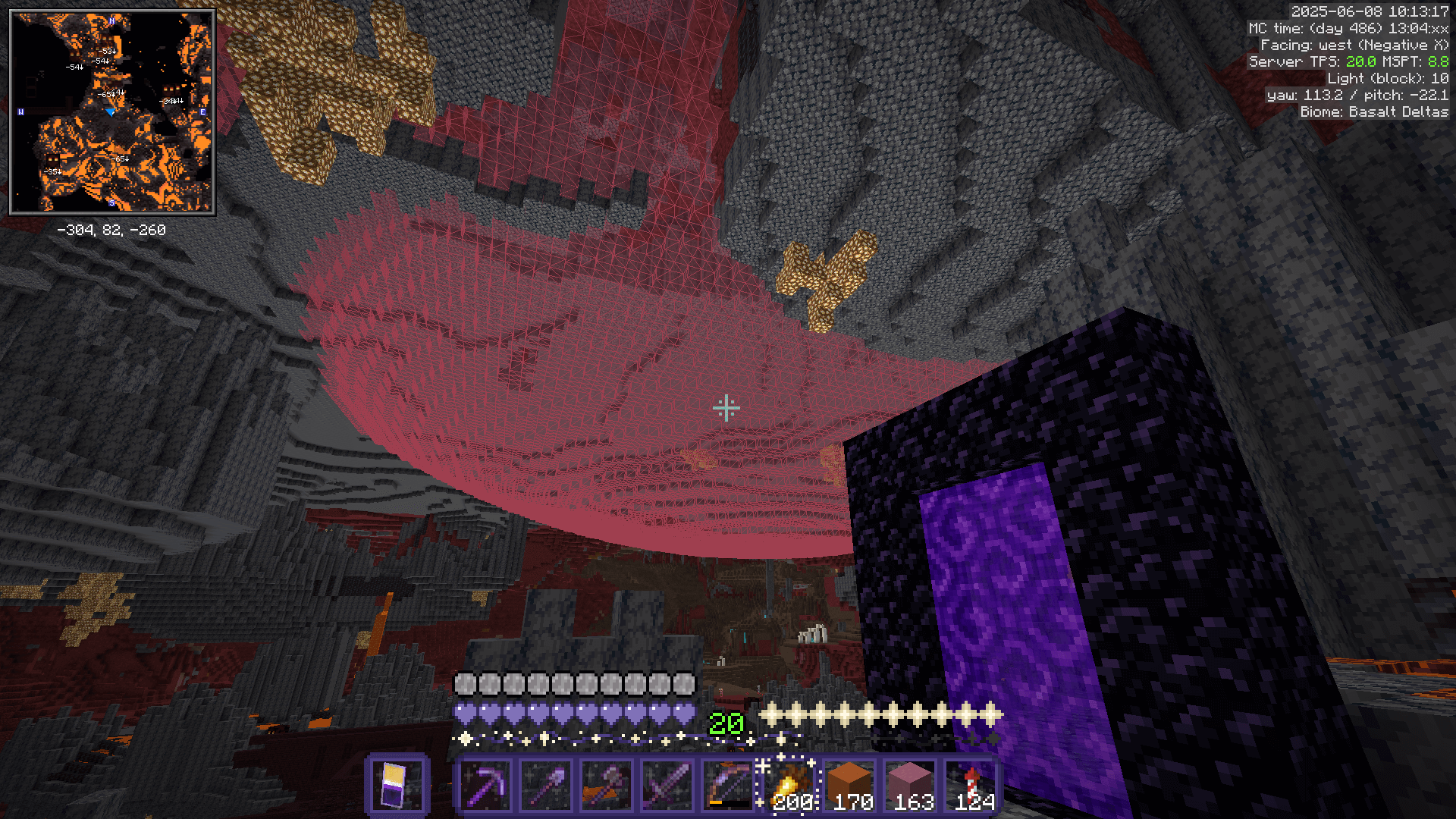 The MiniHUD despawn sphere cutting through the ceiling of the nether in a basalt deltas biome.