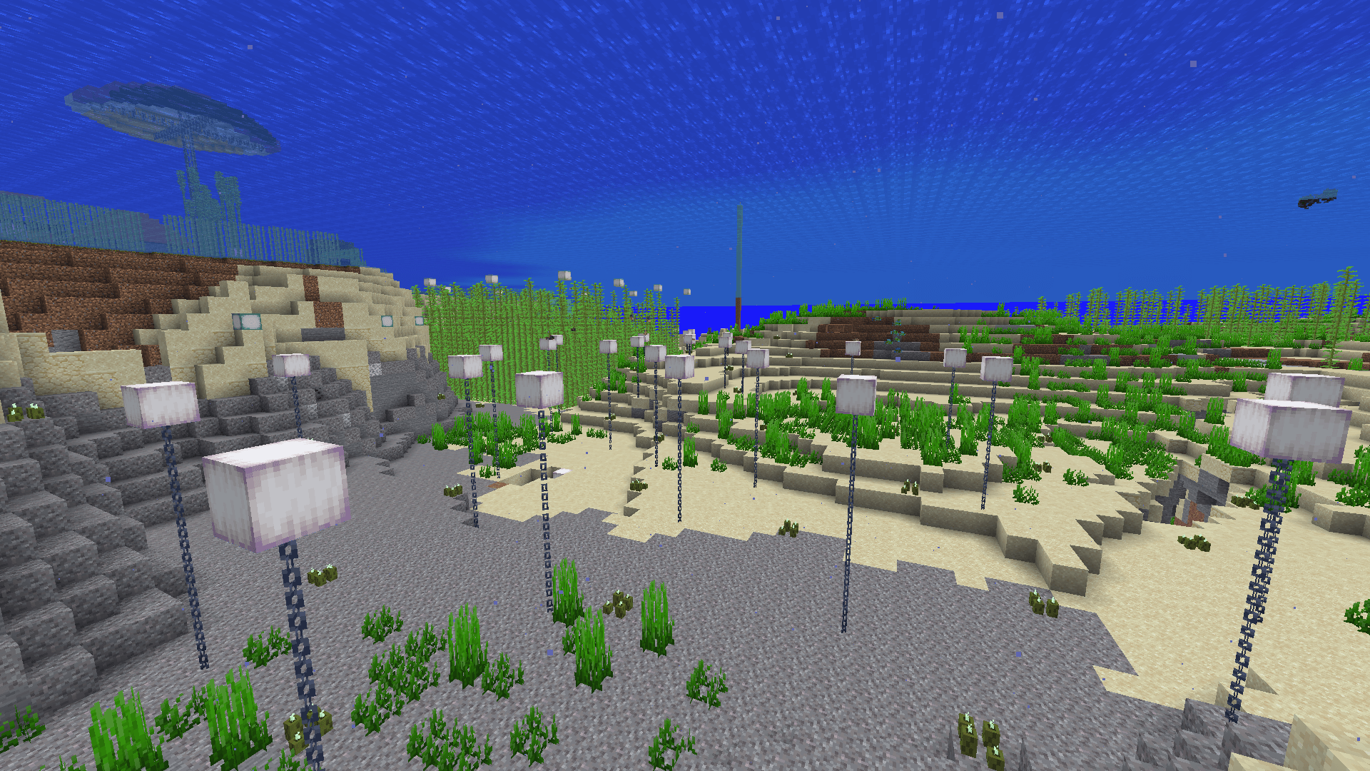 An array of froglights attached to chains connected to the seafloor. Clusters of sea pickles dot the area to provide additional light.