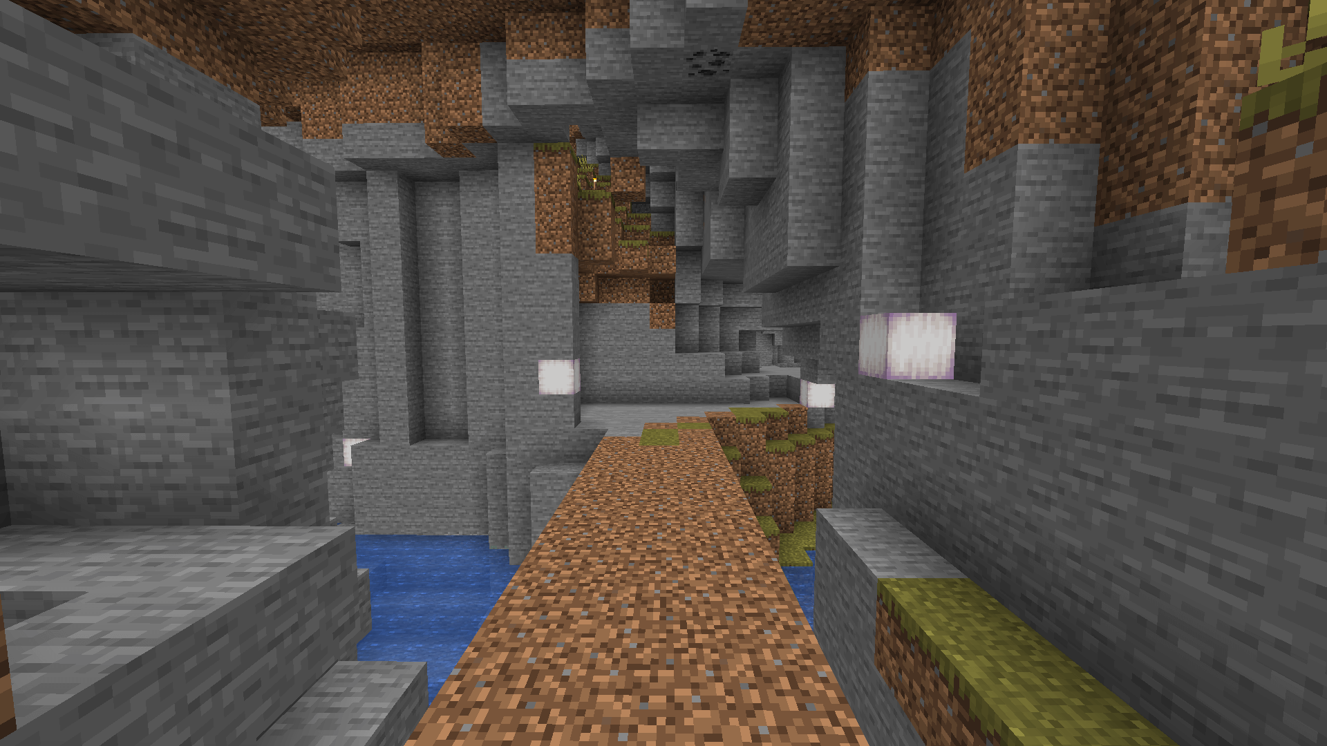 A dirt path leading to a small cave in a savanna hill, with some froglights for illumination.