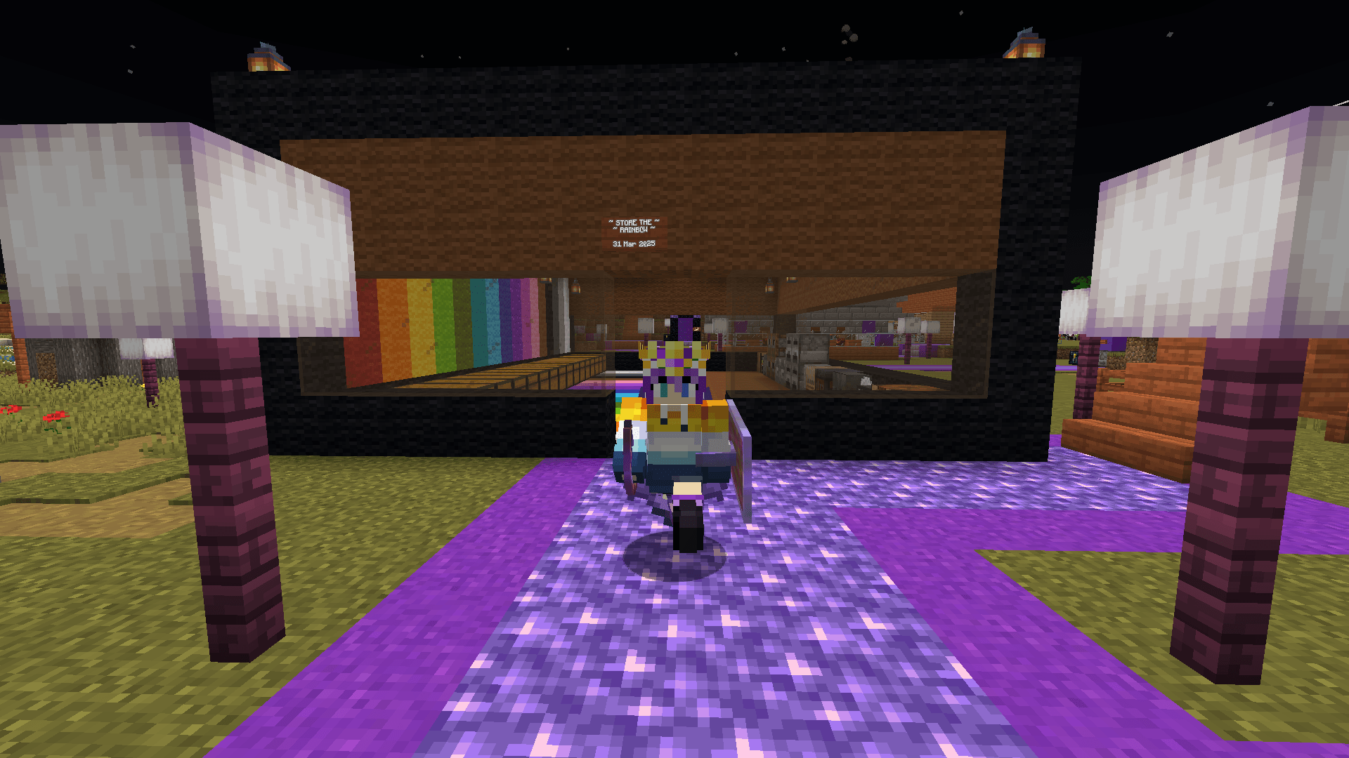 Ela walks along an amethyst path, between two froglight lamp posts, in front of a storage room.