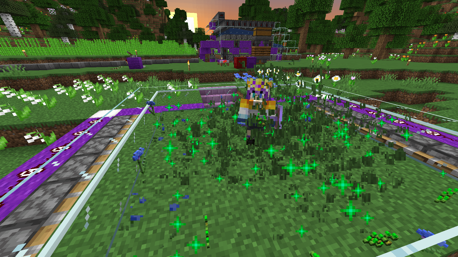 Ela stands on a grass platform enclosed with glass, as cornflowers, seeds, and green growth particles fly about.