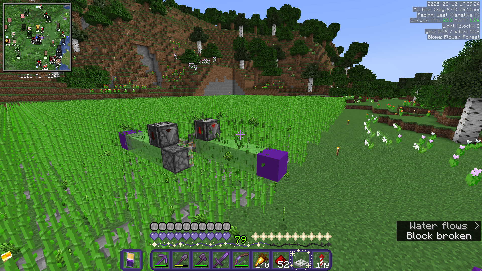 A redstone 'flying machine', consisting of sticky pistons, observers, and slime blocks, that can move across the world by itself and break sugarcane plants.