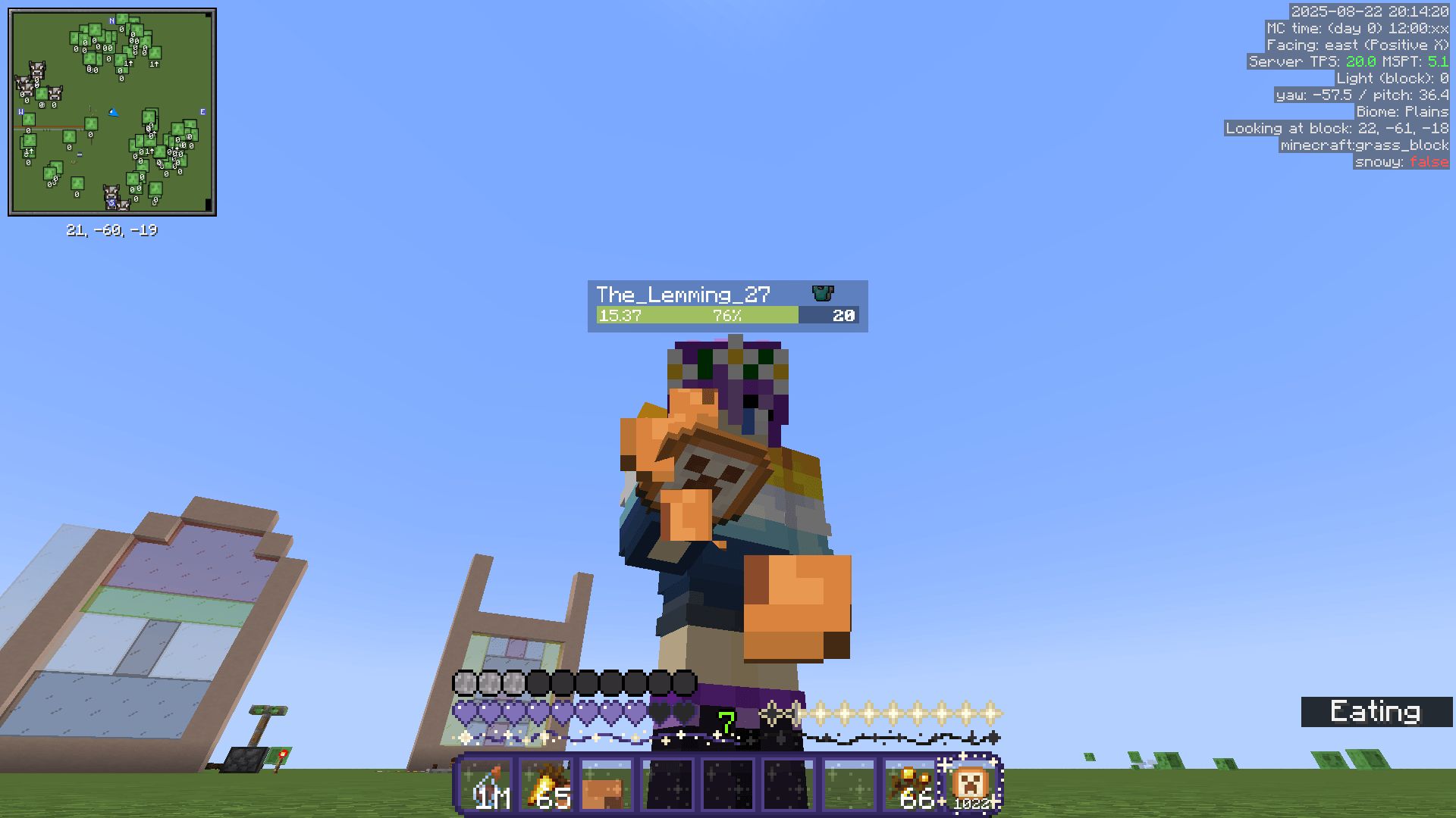 Ela eats a modded cookie food item with a creeper face on it, in a superflat world.