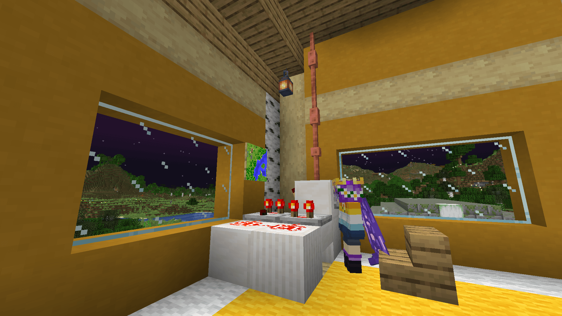 Ela stands in front of a makeshift 'computer' consisting of some redstone components, a map, and copper lightning rods running up to the ceiling.