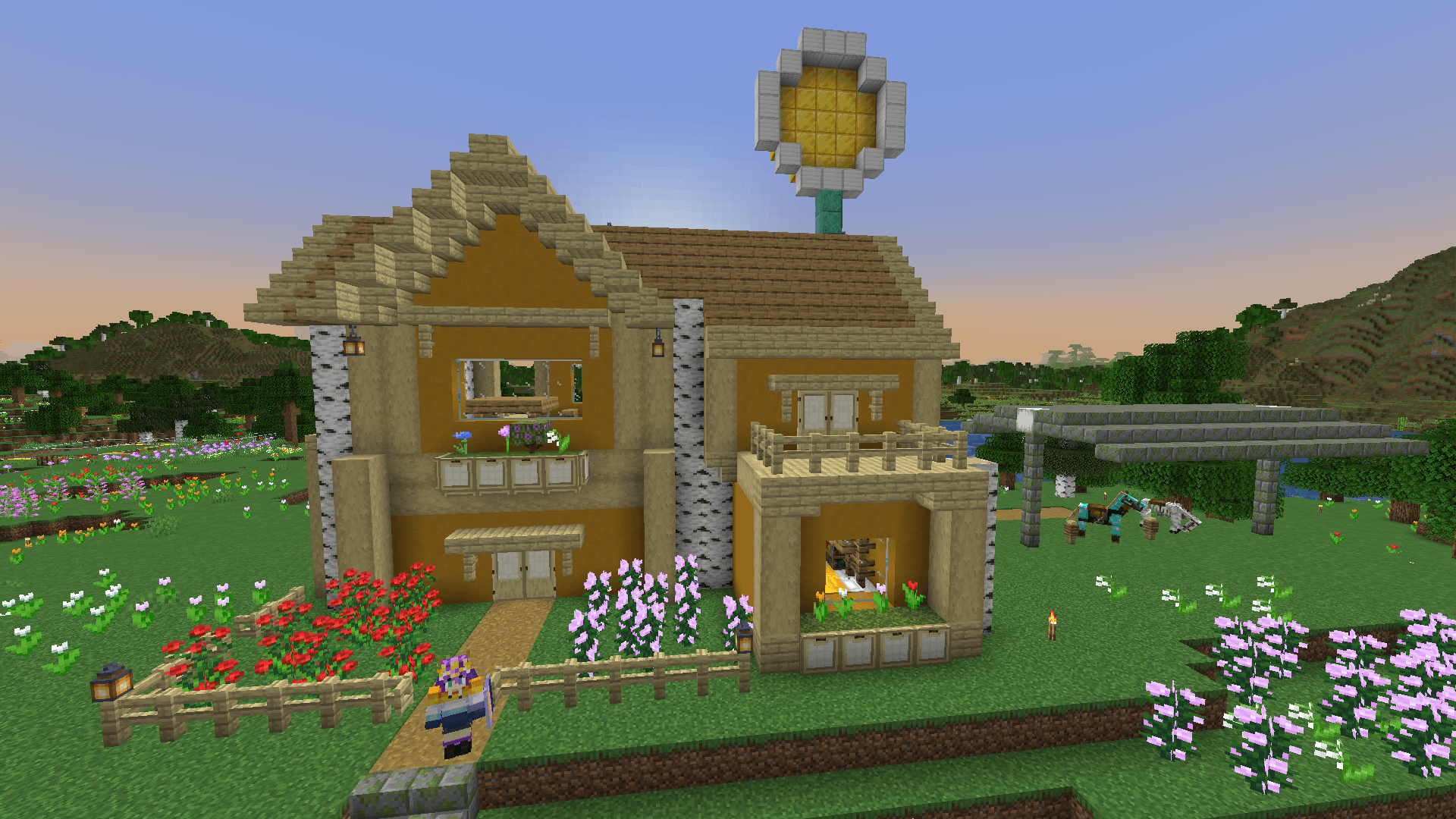 A birch, oak, and yellow terracotta house, with a balcony and several flowery decorations. To the right is a mossy stone shelter with a horse and a skeleton horse.