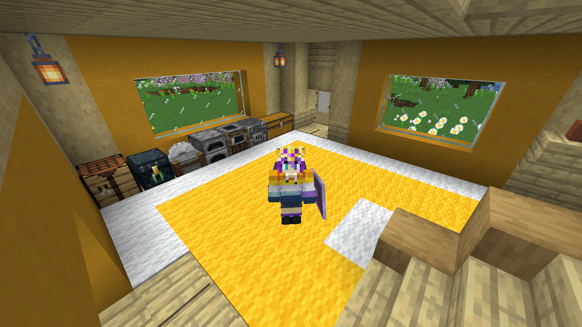 Ela stands in the entranceway of a house, at the foot of a staircase, in front of a row of storage and crafting blocks.